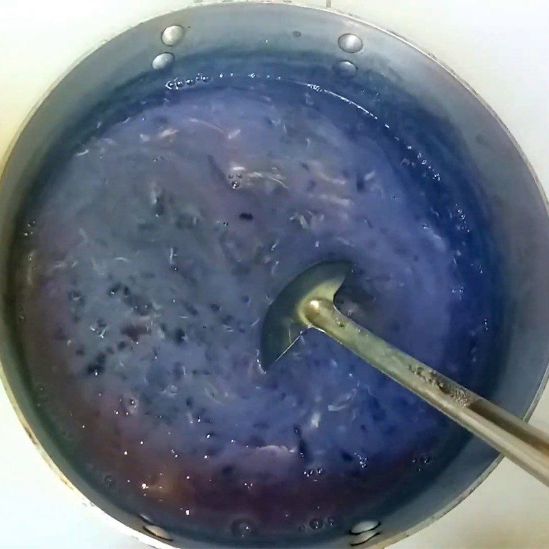Step 5 Cooking porridge with eggs and milk Purple sweet potato egg porridge