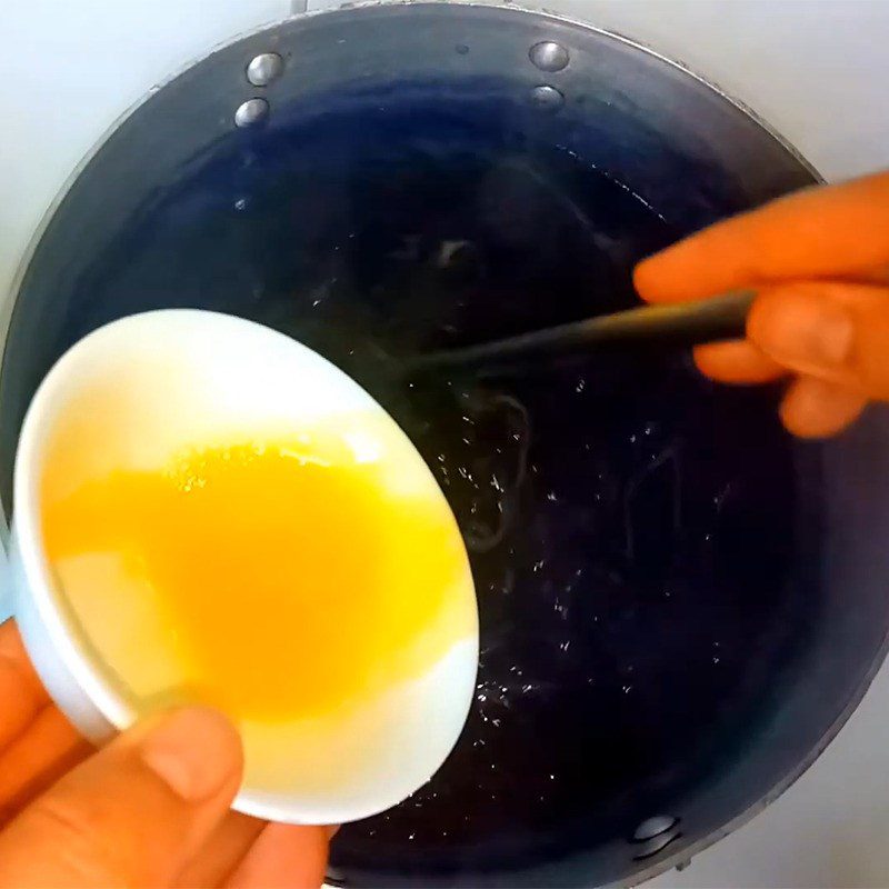 Step 5 Cooking porridge with eggs and milk Purple sweet potato egg porridge