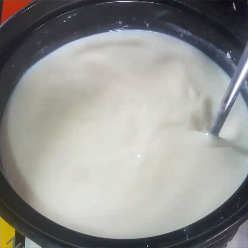 Step 2 Cook coconut milk for banana and taro dessert