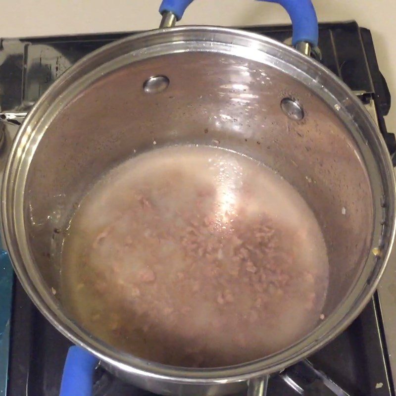 Step 4 Continue cooking beef with potatoes and carrots Potato beef porridge