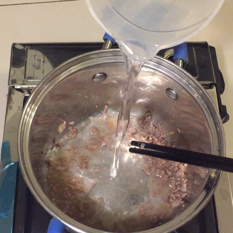 Step 4 Continue cooking beef with potatoes and carrots Potato beef porridge