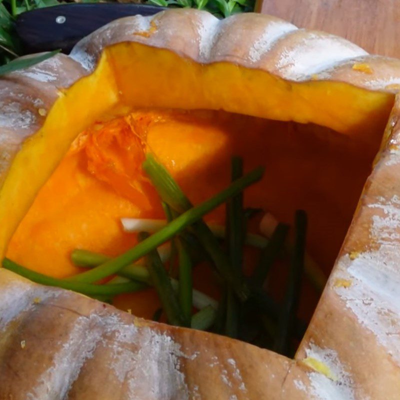 Step 3 Stuff the chicken into the pumpkin for roasted black chicken stuffed with pumpkin