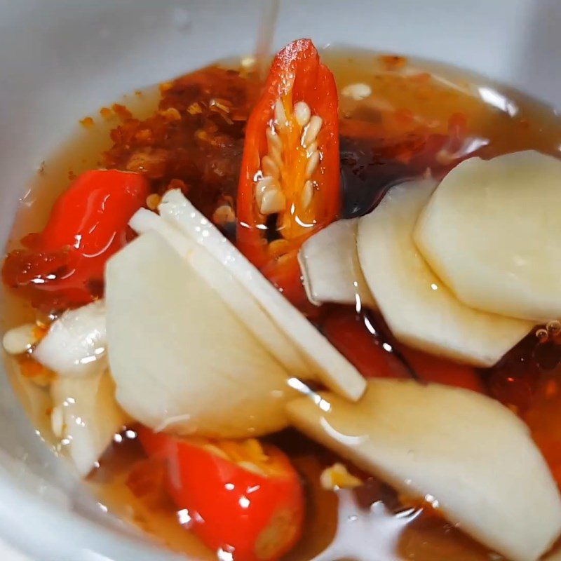 Step 7 Prepare the dipping sauce and finish Pork leg noodle with crispy pork fat and satay
