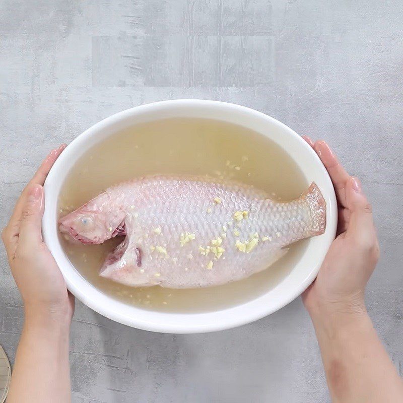 Step 1 Prepare red tilapia for Sour Bamboo Shoot Soup