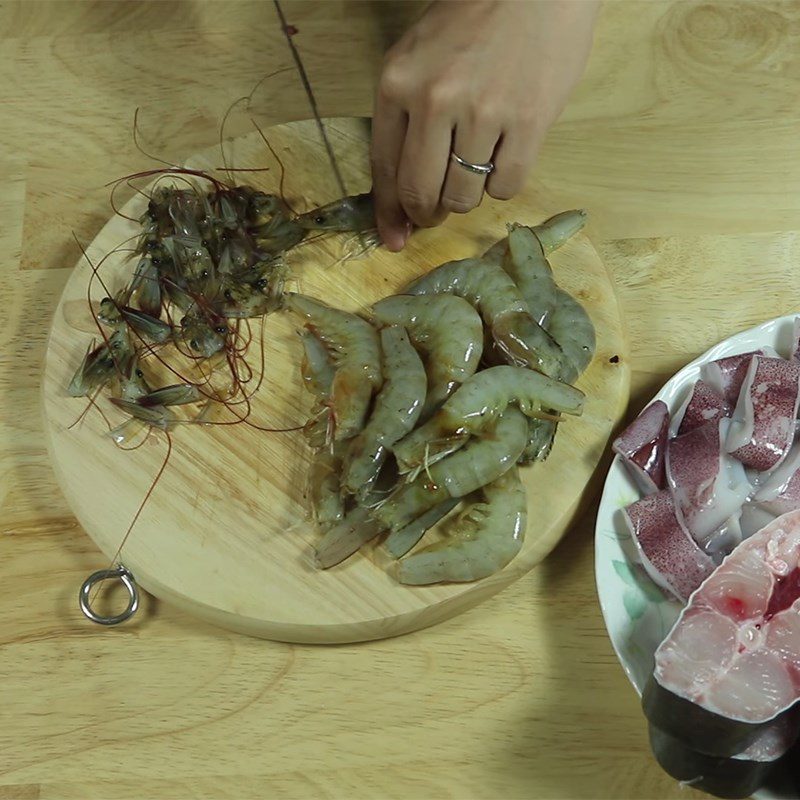 Step 1 Prepare seafood and meat for Fish Hotpot with Fermented Fish Sauce