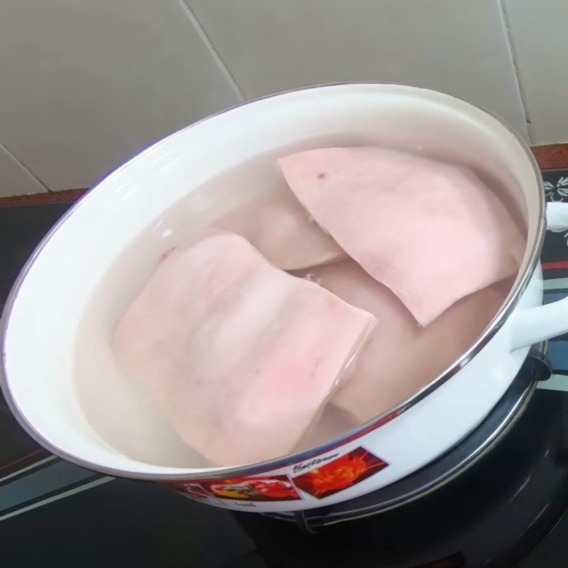 Step 1 Prepare and boil the back fat skin for Dried Mango Salad with Chicken