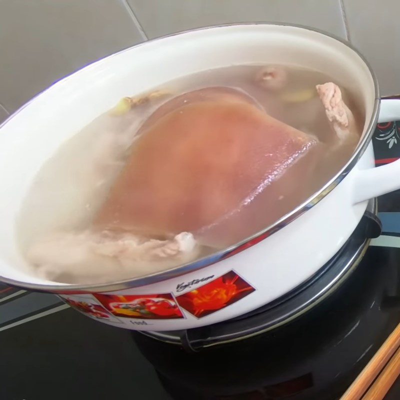 Step 1 Prepare and boil the pork fat back for dried mango salad with crispy chicken