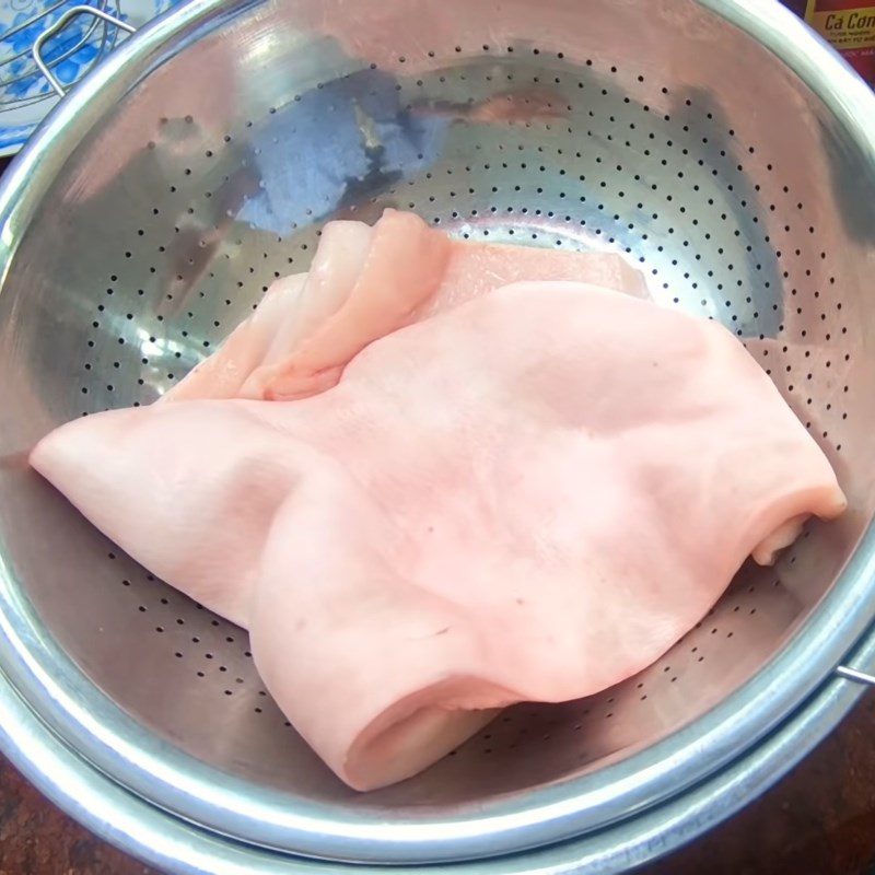 Step 1 Prepare and boil the back fat skin for Dried Mango Salad with Chicken