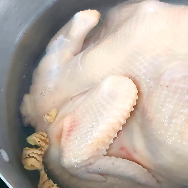 Step 1 Prepare and boil the chicken Whole Chicken Fried with Garlic Butter Sauce