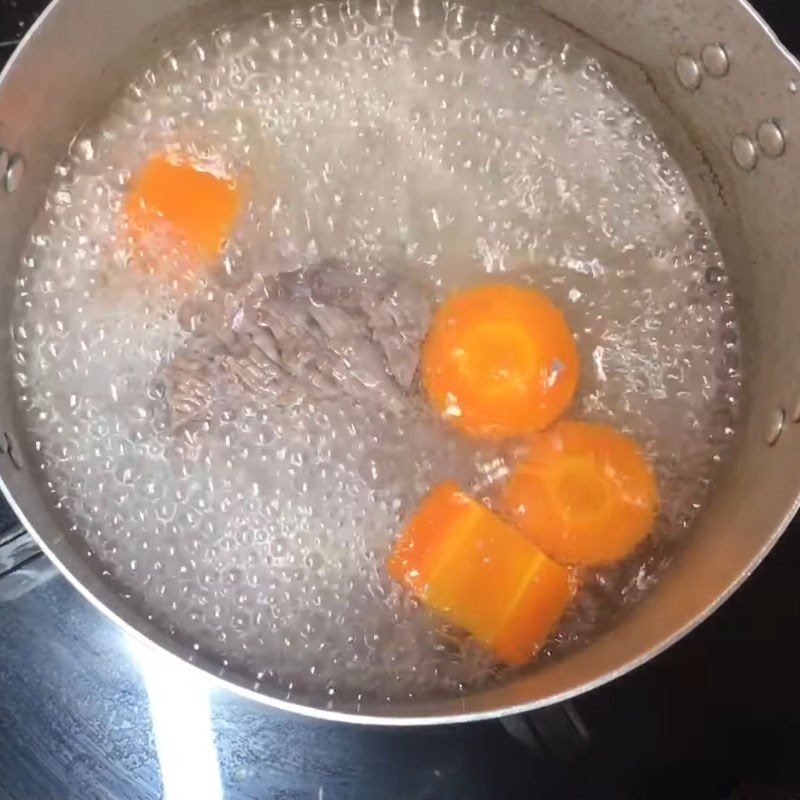 Step 1 Prepare and boil beef, carrot Beef porridge with water spinach and carrot