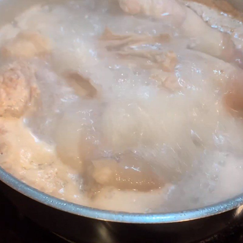 Step 1 Preparation and blanching of pig tails for Pig Tail Noodles