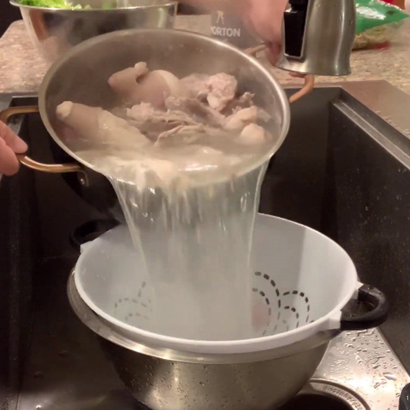 Step 1 Preparation and blanching of pig tails for Pig Tail Noodles