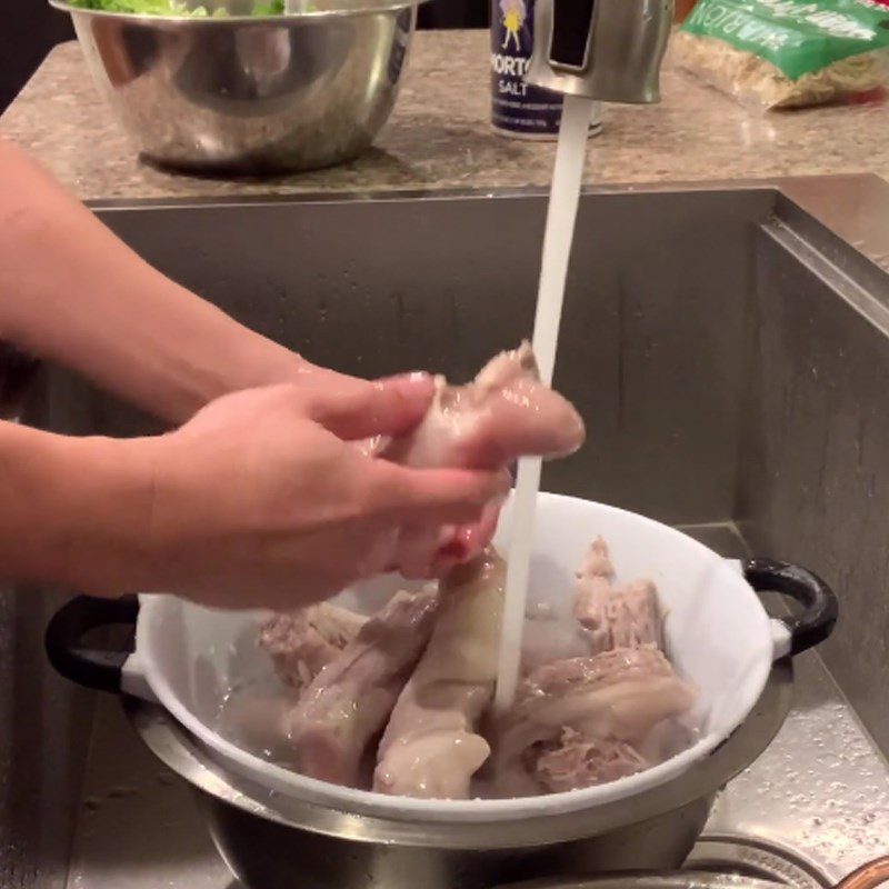 Step 1 Preparation and blanching of pig tails for Pig Tail Noodles