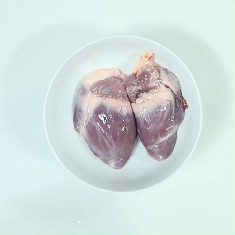 Step 2 Prepare and marinate the pork heart Steamed Pork Heart with Lotus Seeds