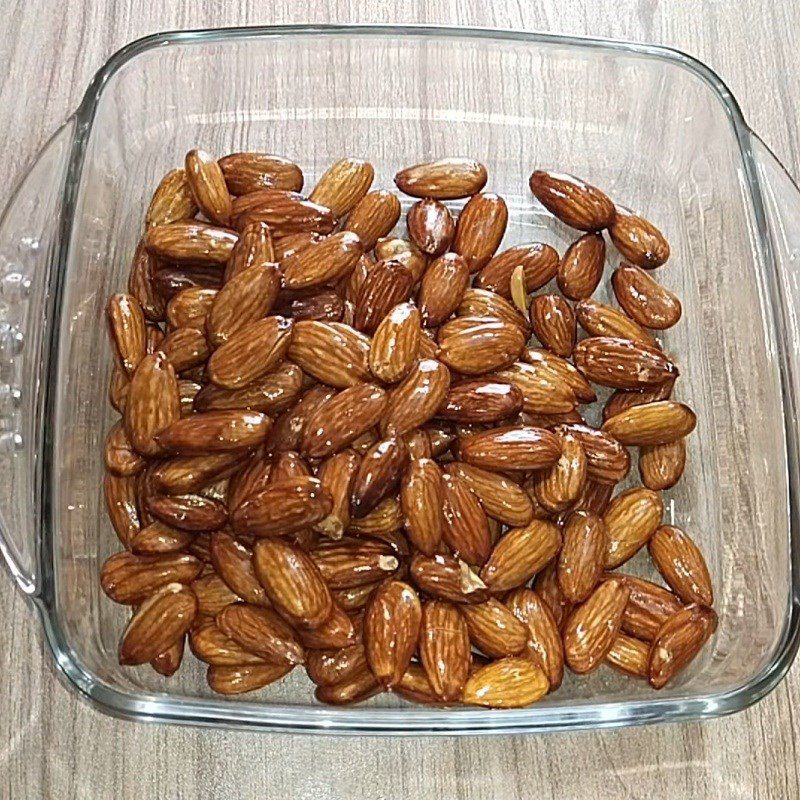 Step 2 Drain oil and toss salted almonds Salted roasted almonds