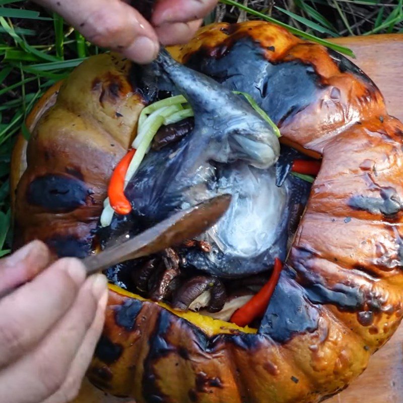 Step 6 Final Product Grilled black chicken wrapped in aluminum foil stuffed with pumpkin