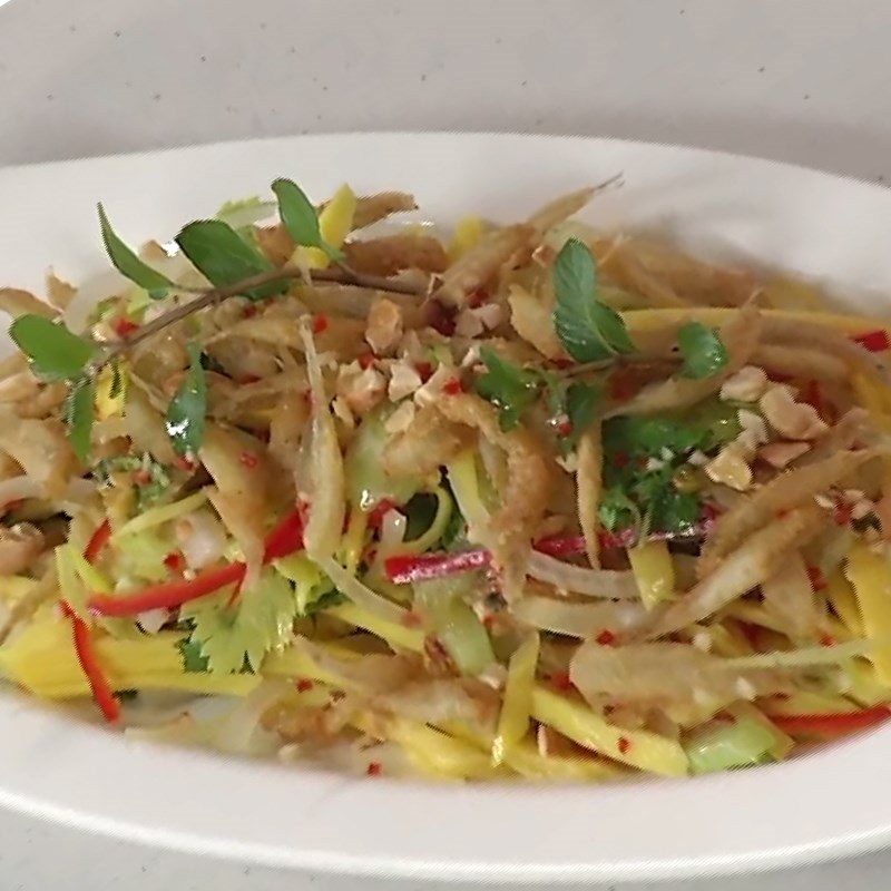 Step 5 Final product Green mango salad with fresh anchovies