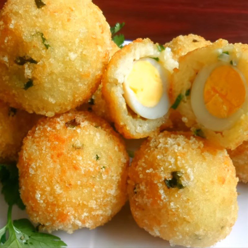 Step 5 Finished product Leftover rice wrapped around quail eggs fried