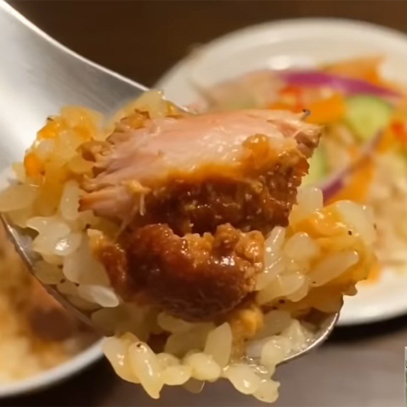 Step 8 Finished product of Northern-style stewed meat sticky rice served with pickled vegetables