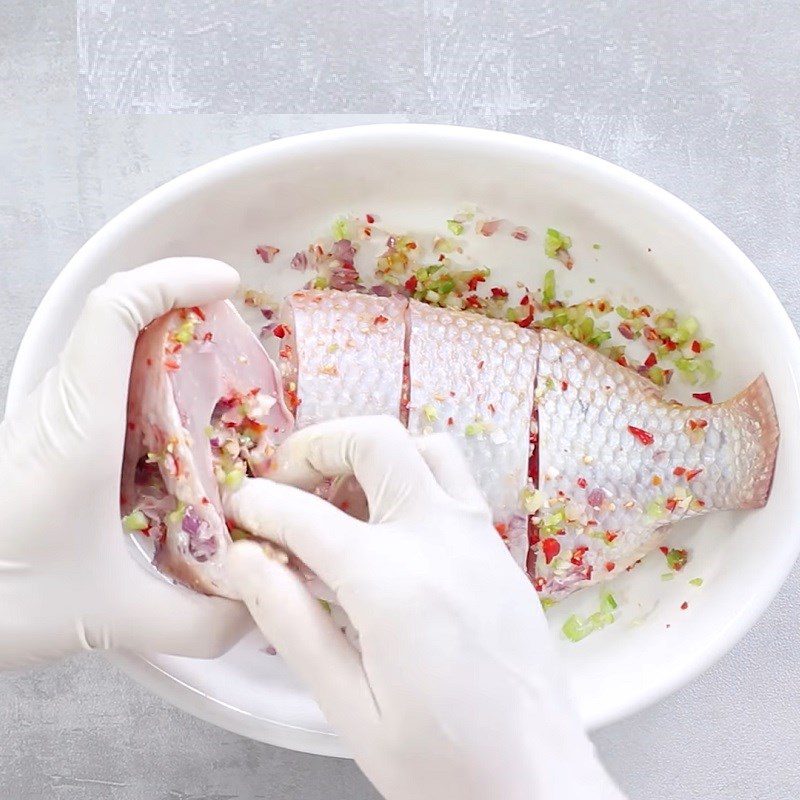 Step 2 Marinate the fish for Sour Bamboo Shoot Soup