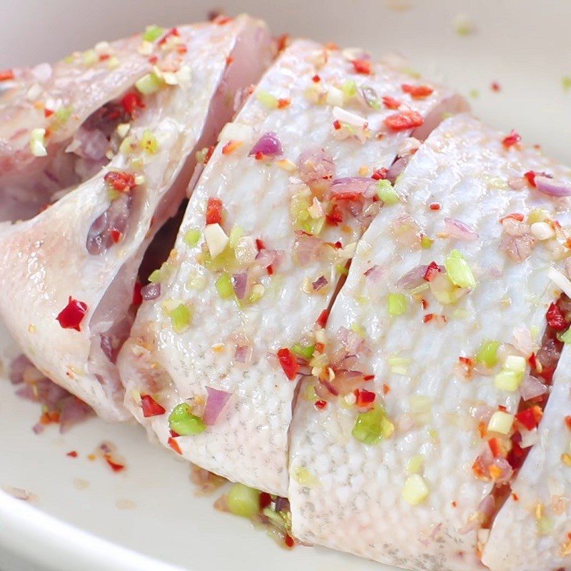 Step 2 Marinate fish with sour bamboo shoot soup with red tilapia