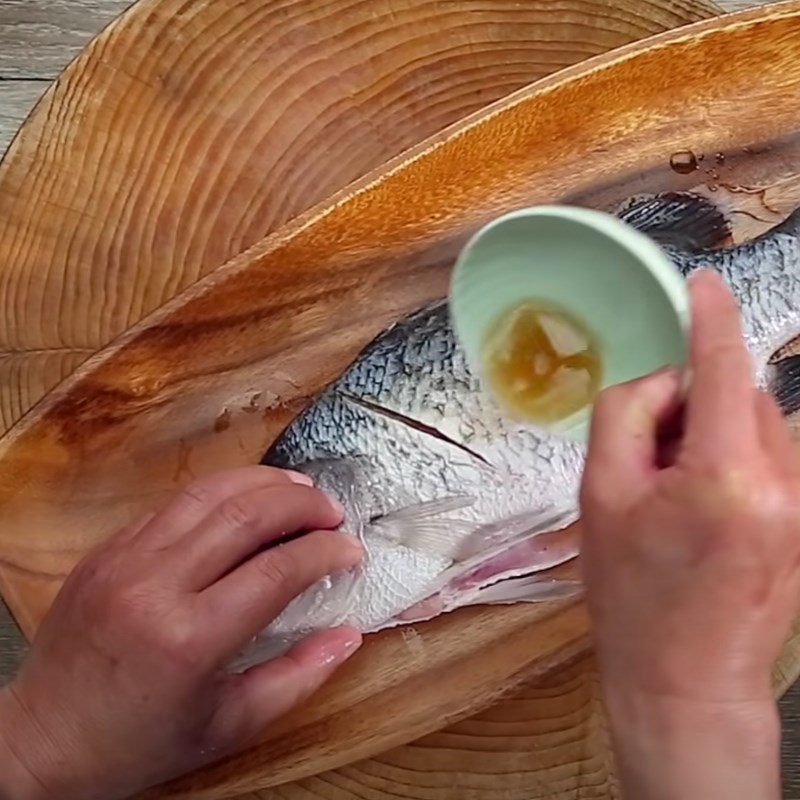 Step 2 Marinate the fish with spices Fried Barramundi with Soybean Sauce