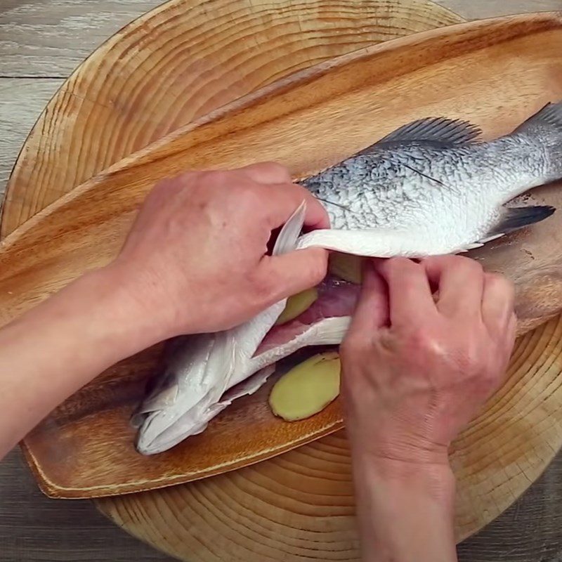 Step 2 Marinate the fish with spices Fried Barramundi with Soybean Sauce