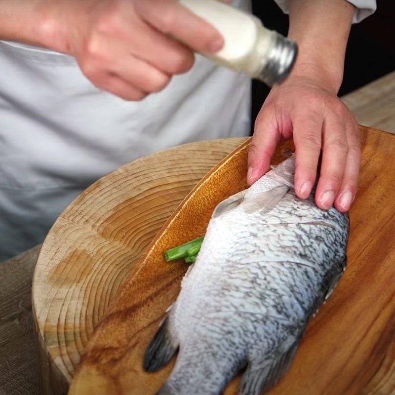 Step 2 Marinate the fish with spices Fried Barramundi with Soybean Sauce