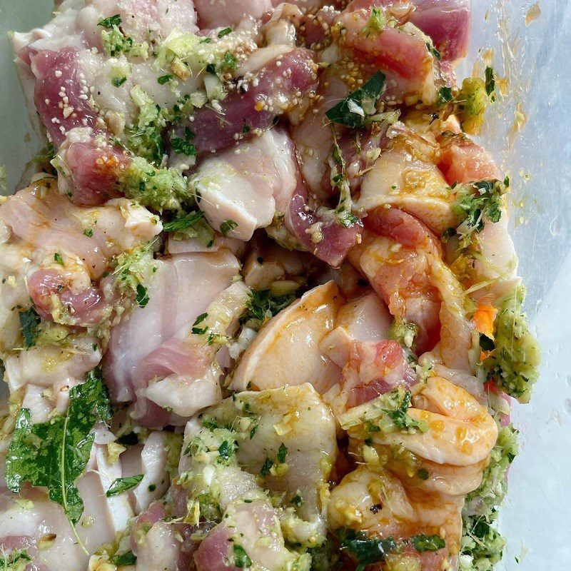 Step 2 Marinate meat for Grilled Pork Skewers with Moc Mat Leaves