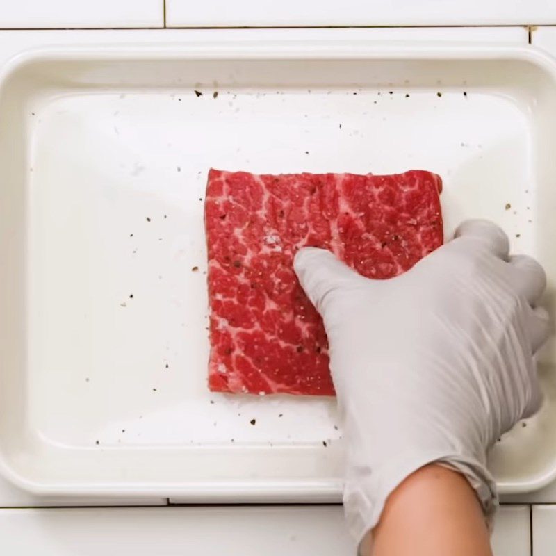 Step 1 Marinate the beef for Fried Beef Sandwich