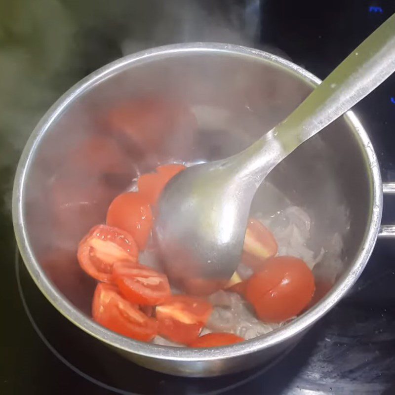 Step 2 Sautéing tomatoes for Sour Mushroom Soup