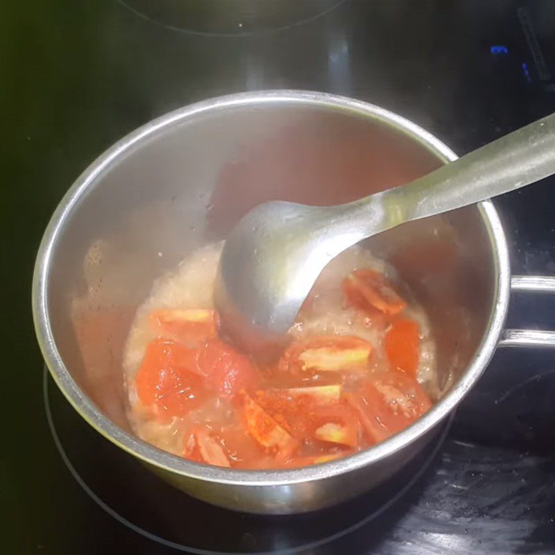 Step 2 Sautéing tomatoes for Sour Mushroom Soup