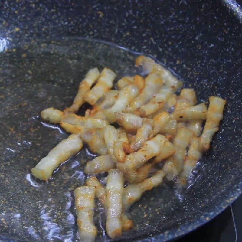 Step 3 Stir-frying meat Basa fish with pork belly