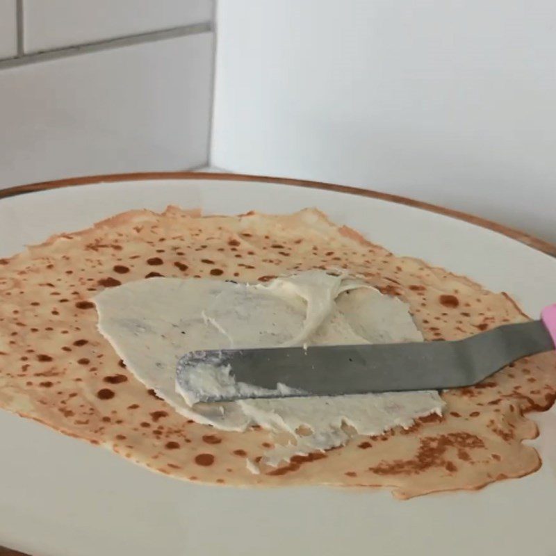 Step 6 Spread cream and cut the cake Banana crepe cake with avocado cream and nutella