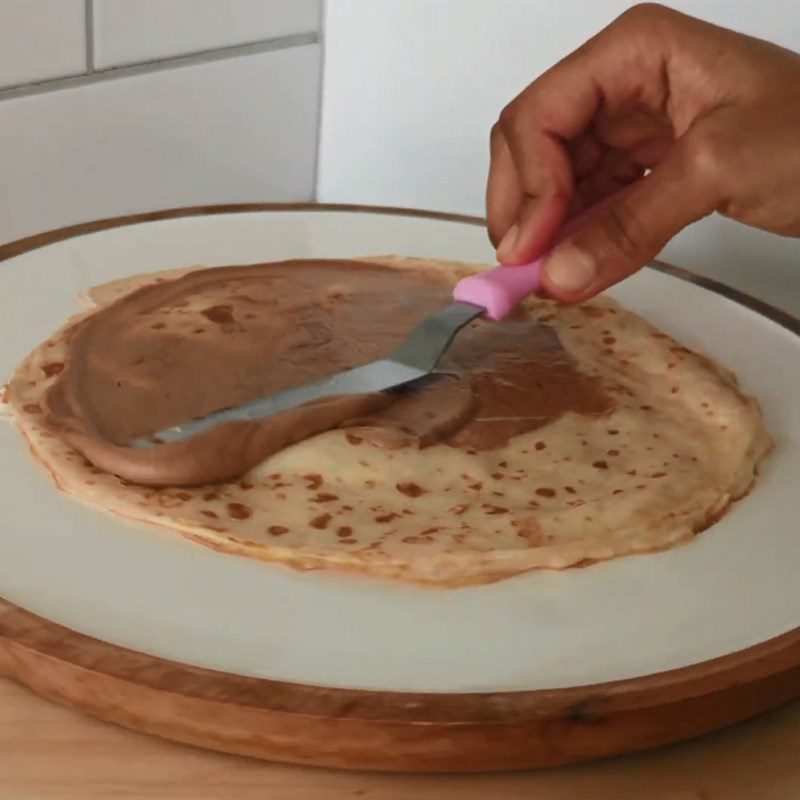 Step 6 Spread cream and cut the cake Banana crepe cake with avocado cream and nutella