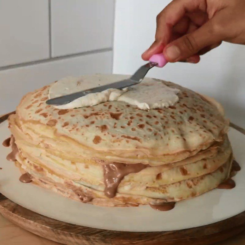 Step 6 Spread cream and cut the cake Banana crepe cake with avocado cream and nutella