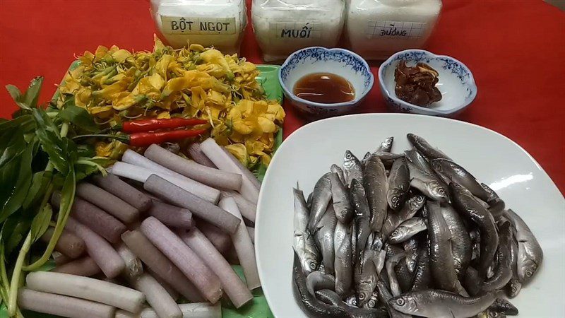 Ingredients for sour soup with linh fish and water lily blossoms and giant river lily blossoms