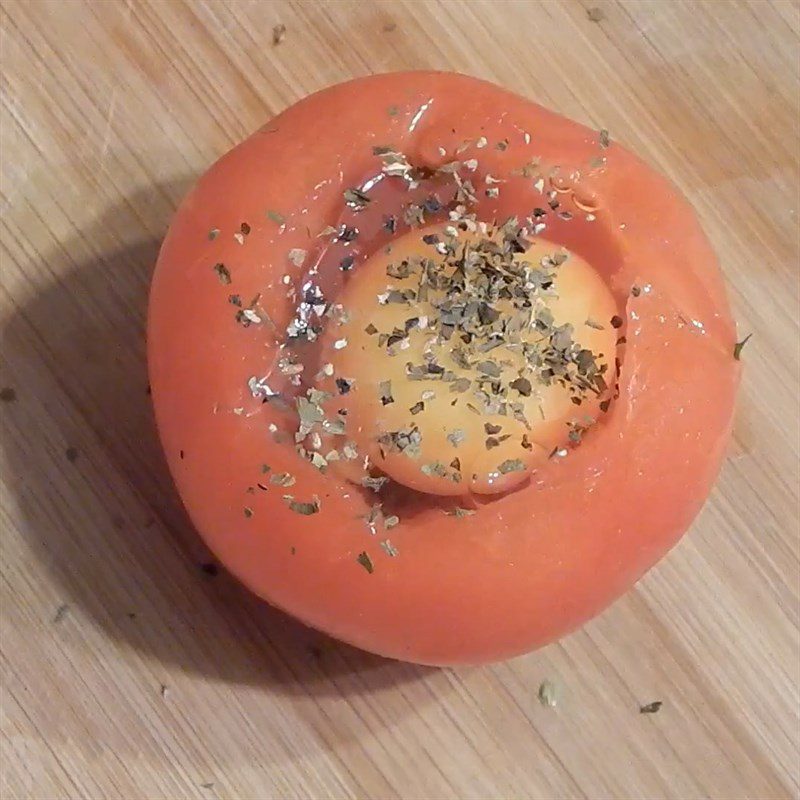 Step 2 Put eggs into baked tomatoes