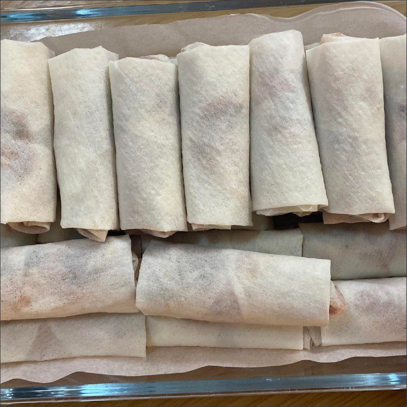 Step 2 Rolling and frying spring rolls and making dipping sauce How to make bun cha gio with homemade spring rolls
