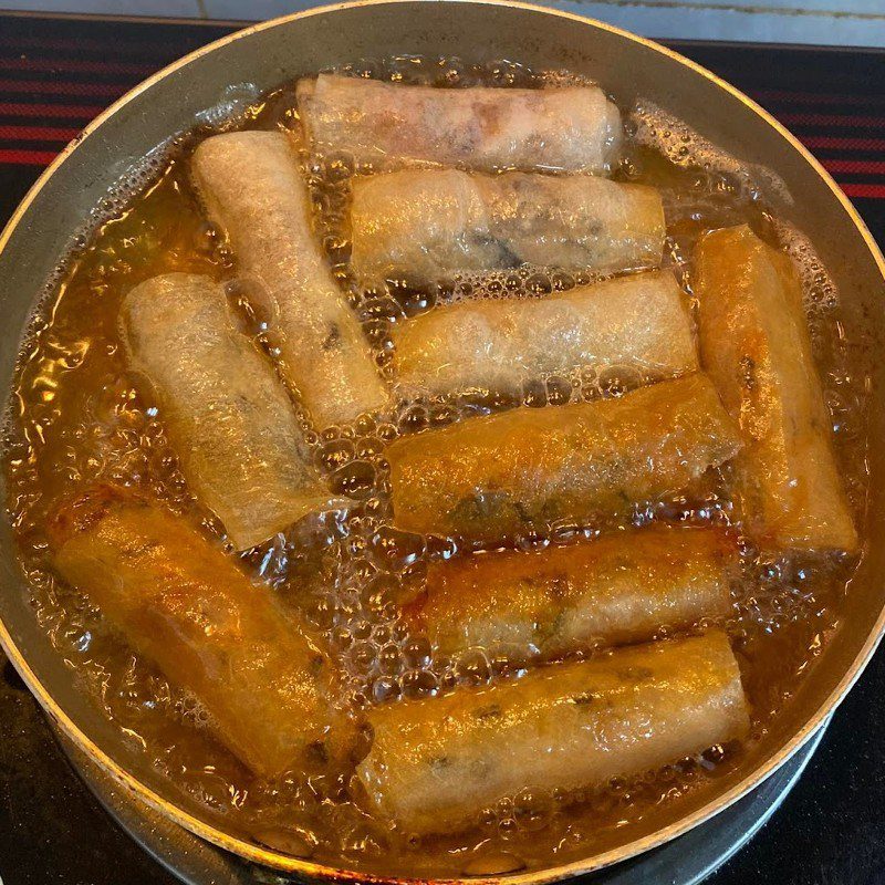 Step 2 Rolling and frying spring rolls and making dipping sauce How to make bun cha gio with homemade spring rolls