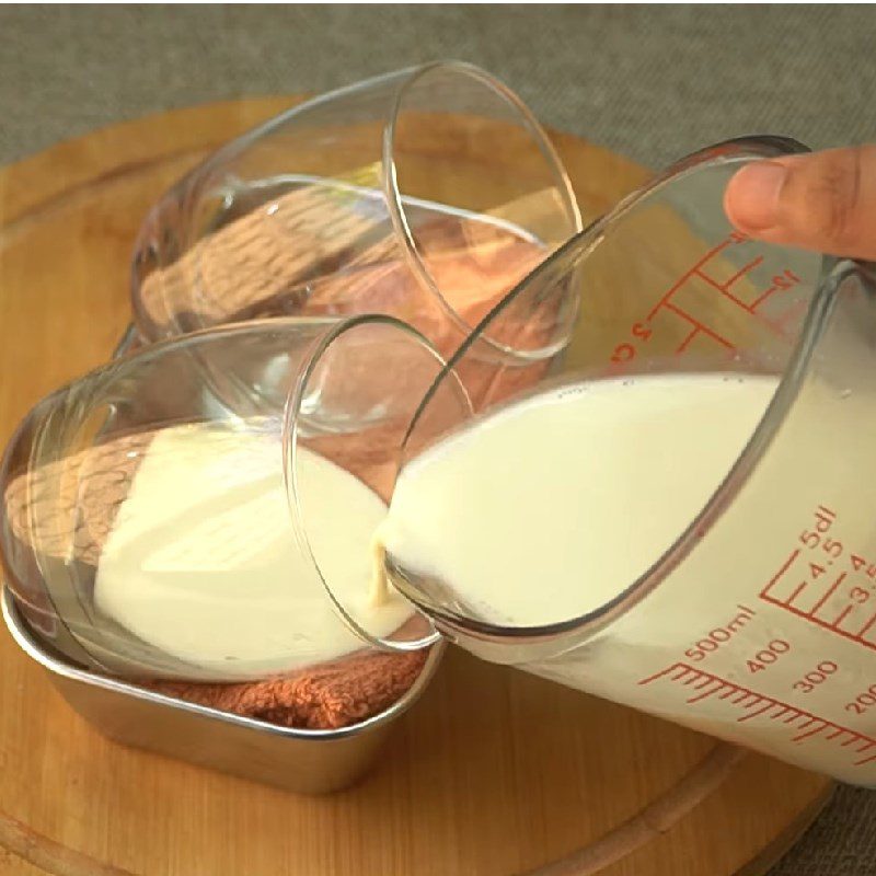 Step 2 Heat the milk mixture and pour the first layer for Mango Panna Cotta