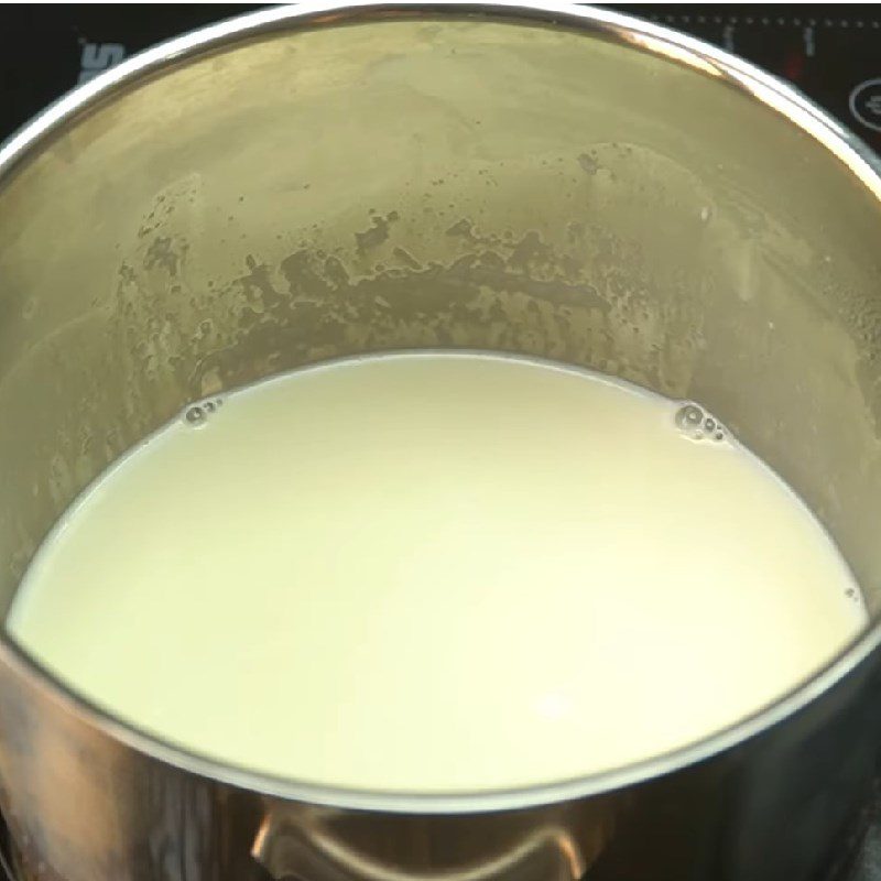 Step 2 Heat the milk mixture and pour the first layer for Mango Panna Cotta