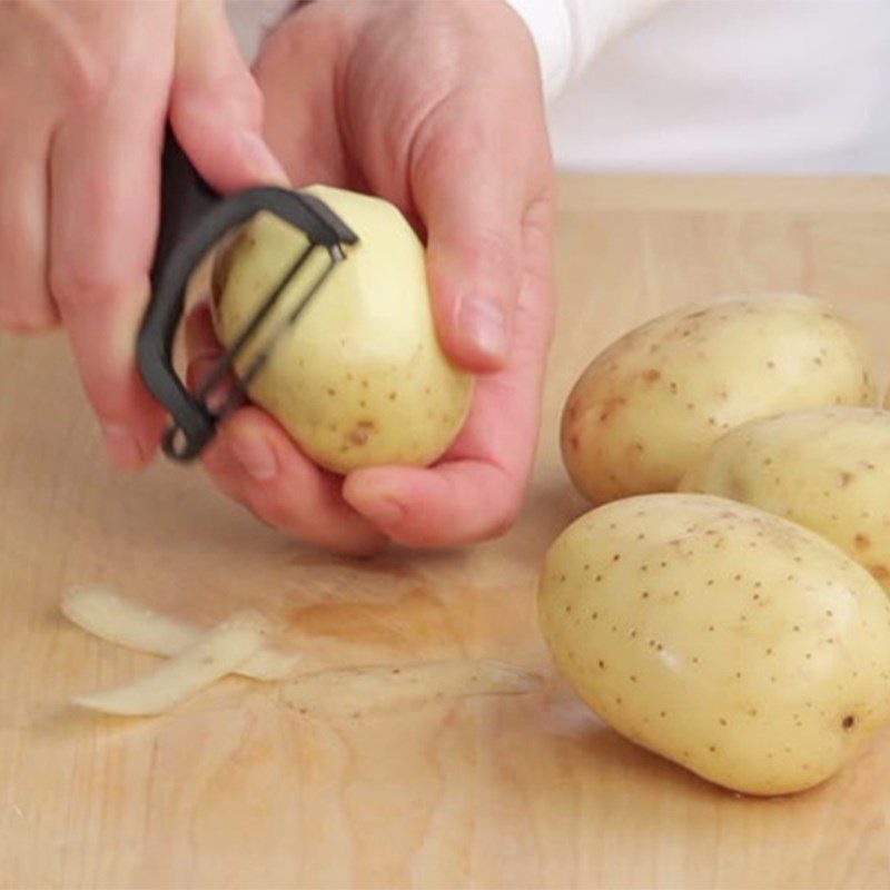 Step 1 Peel the potatoes for cheesy potato fries