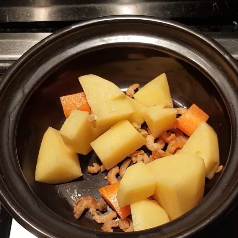 Step 2 Simmer potatoes, carrots with dried shrimp Potato carrot soup