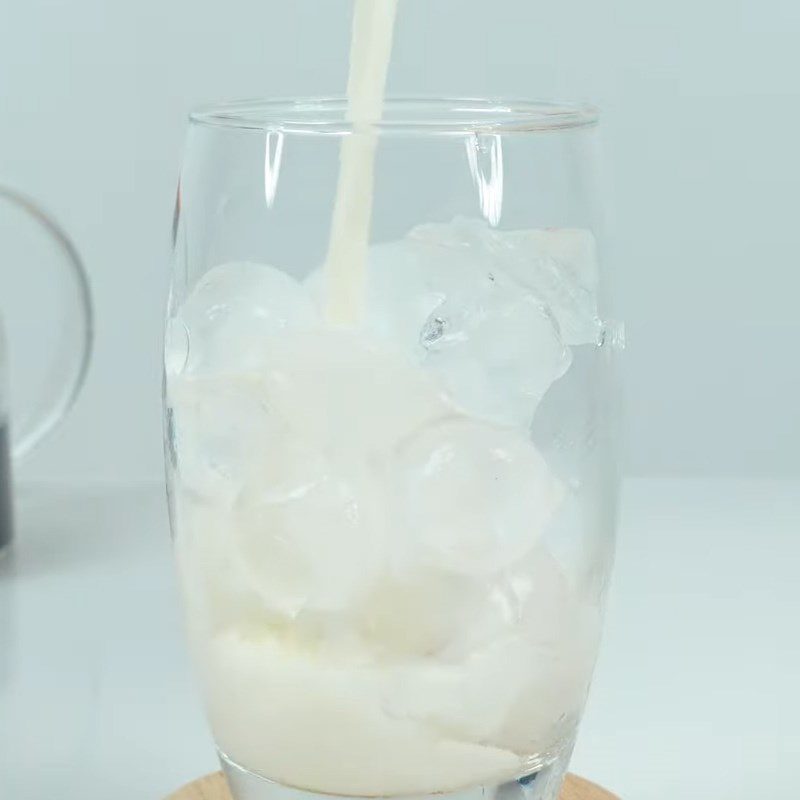 Step 5 Complete butterfly pea flower milk tea macchiato with coconut ice cream