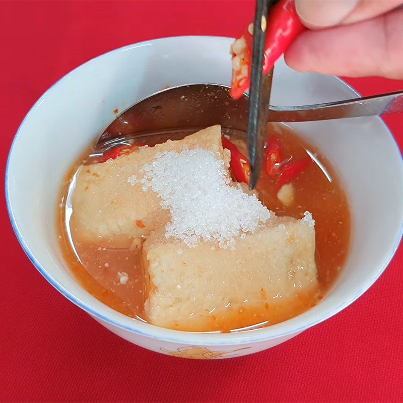 Step 4 Making the dipping sauce for hotpot Roasted pork hotpot with fermented tofu