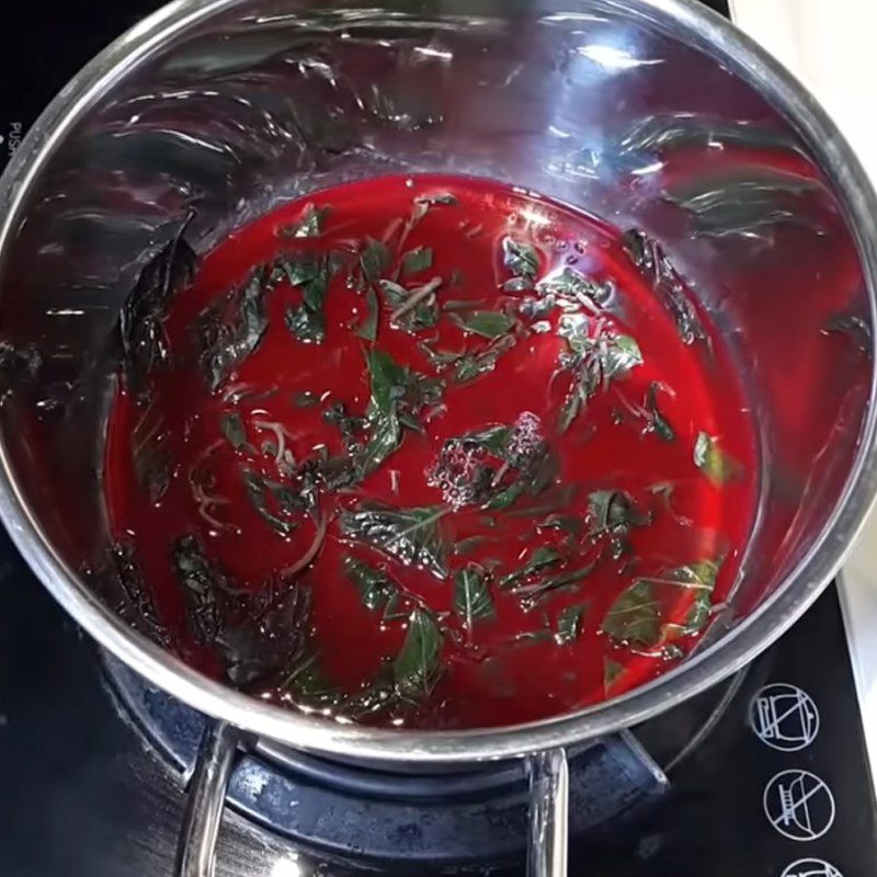 Step 1 Extracting color from purple sticky rice leaves for Green Bean Sticky Rice using a rice cooker