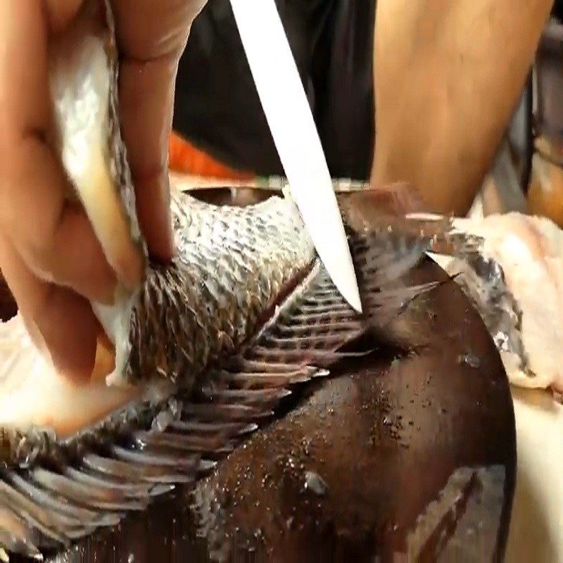 Step 1 Prepare the Fish for Sour Pickled Tilapia Hot Pot