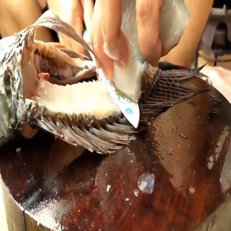 Step 1 Prepare the Fish for Sour Pickled Tilapia Hot Pot
