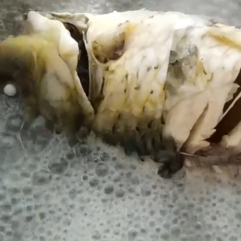 Step 2 Boil and separate the carp meat for Carp congee with lotus seeds